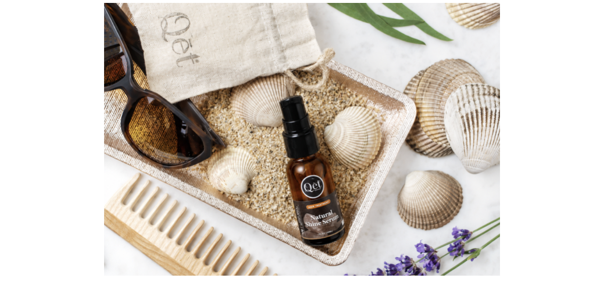 Natural Shine Serum with sea shells, lavender flowers, sunglasses and wooden comb.